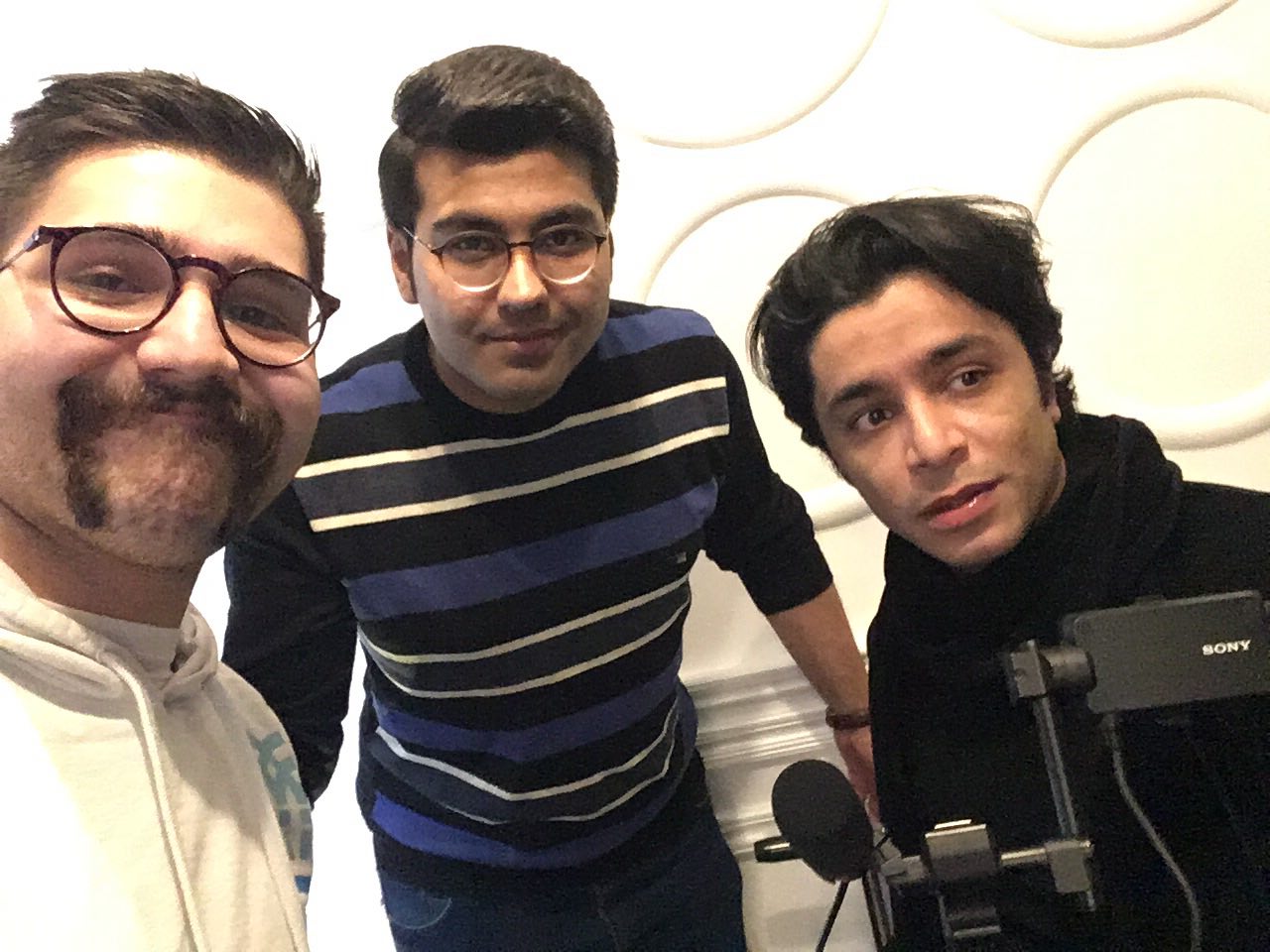 arash bahmani and two of his crew behind the scene of a music video recording