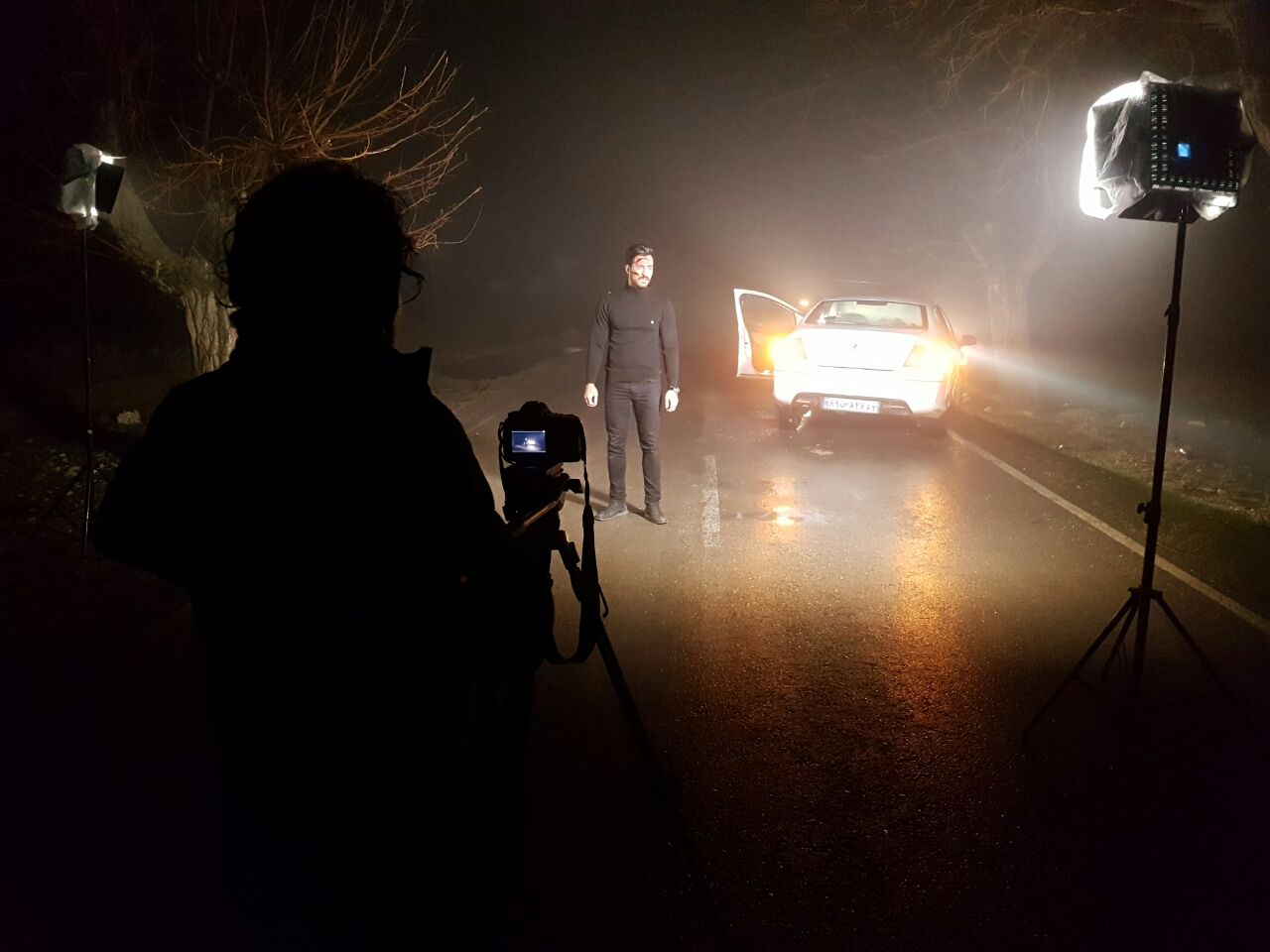 arash bahmani shooting a outdoor scene under the heavy rain in Mashahd -Iran