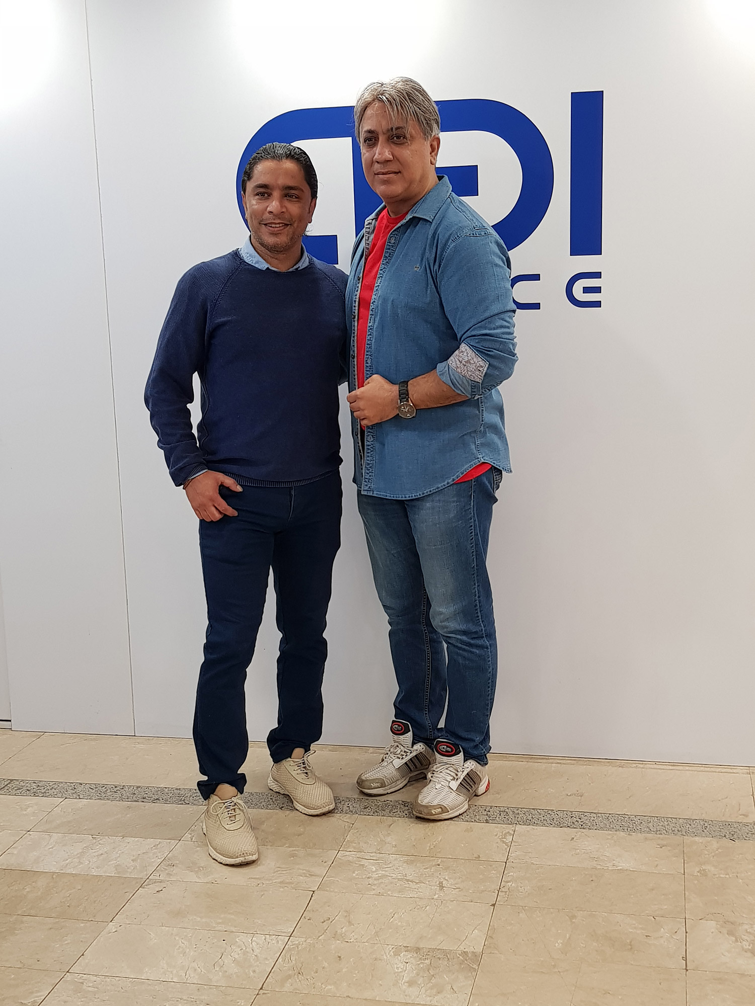 Iran's art stars football team program directed by Arash Bahmani - arash bahmani with a blue shirt and white shoes standing front the camera